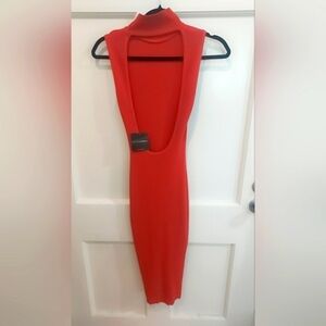 Beautiful, new, never worn, Orange ribbed jlux dress. Knee length
